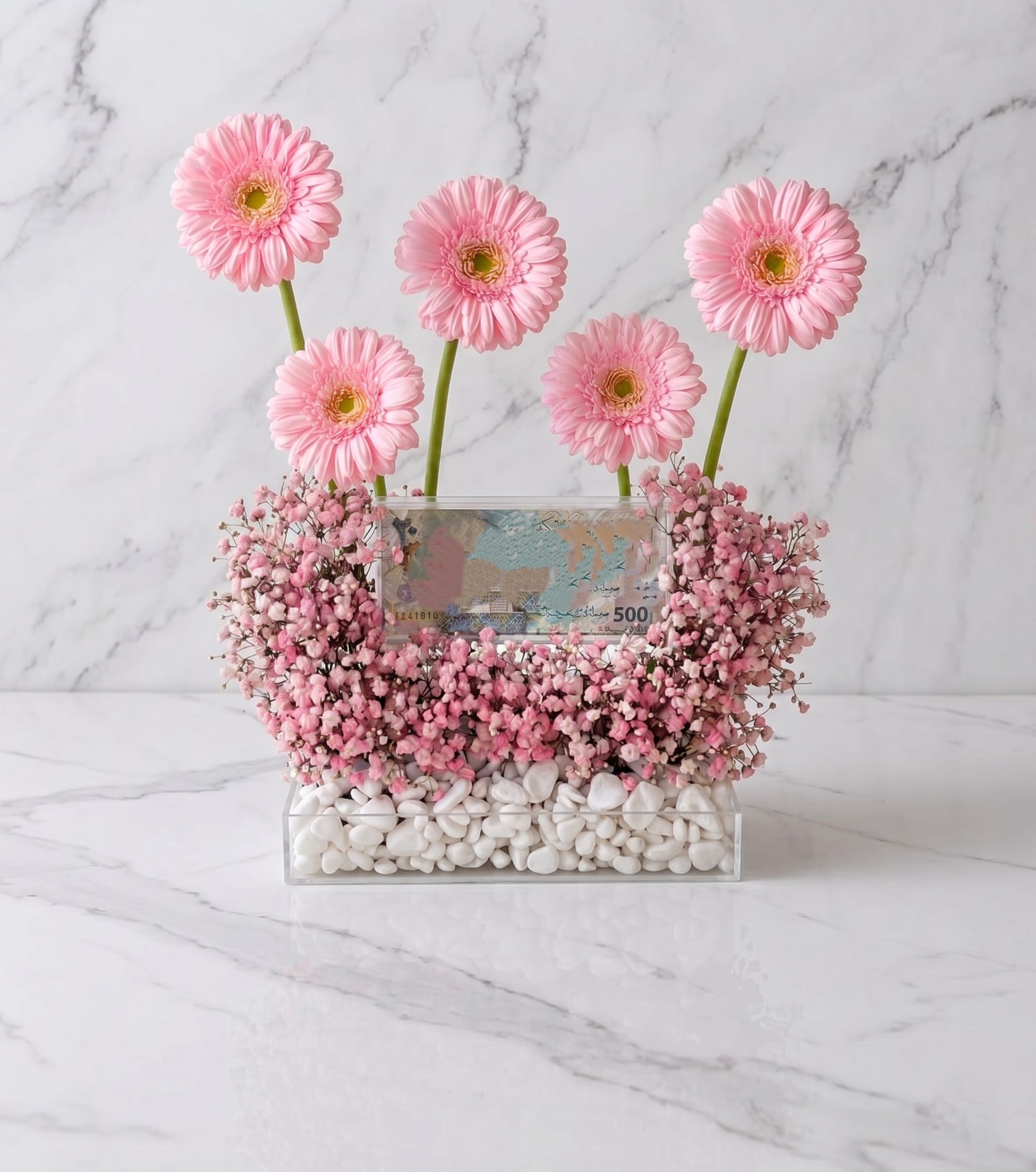 eid special money box with pink gerabera arrangement